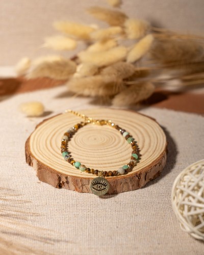 Bransoletka z naturalnego chryzoprazu i tygrysiego oka z symbolem oka to wyjątkowa biżuteria handmade w stylu boho, inspirowana intuicją, naturą i wewnętrzną siłą.